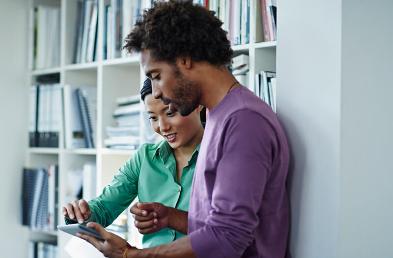 Business professional reviewing regulatory compliance information on computer