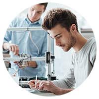 Male students programming equipment