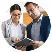 Two business professionals review security & compliance standards