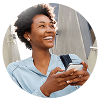 Smiling businesswoman using smart phone