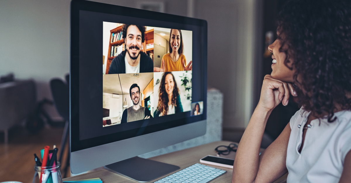 Business professional sitting on floor in modern living room and working on laptop computer. Remote mobile work