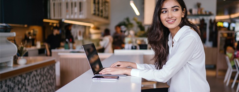 Business man speaking on phone outside