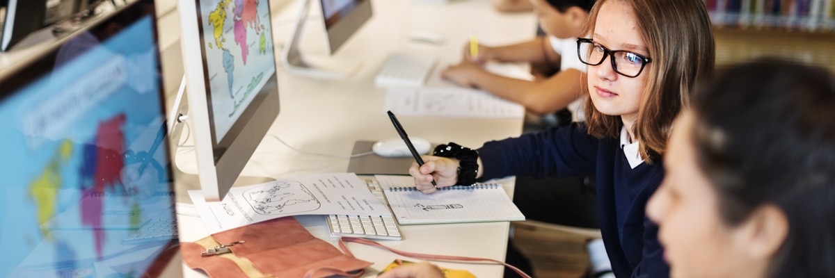 Students working on desktop computers