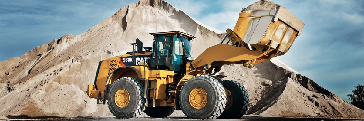 A mining machine carrying earth through site