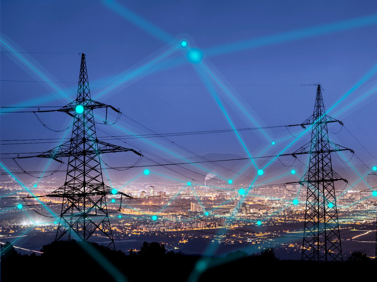 Businessman on laptop computer while taking notes in notebook