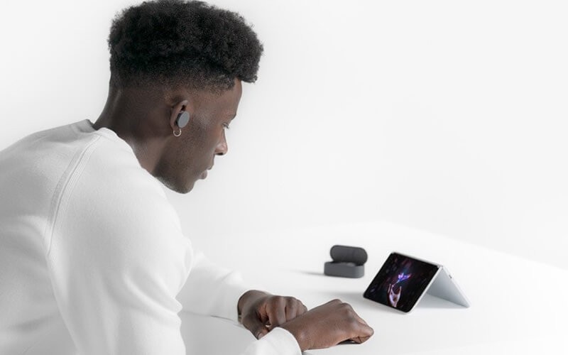 Male watching on Surface duo