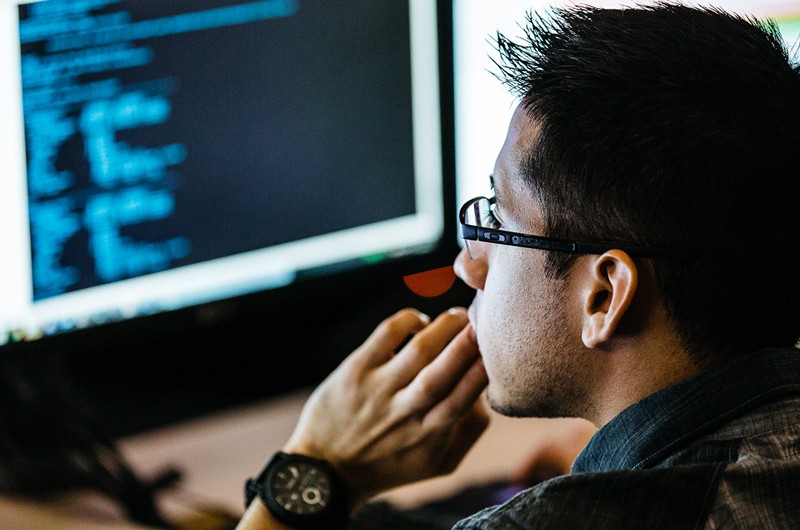 Developer working in front of laptop