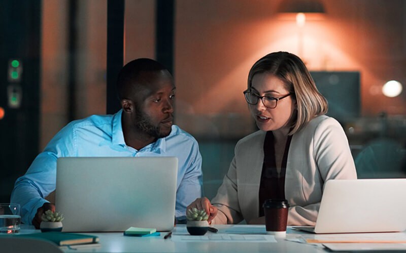 Businessman working outside on tablet device