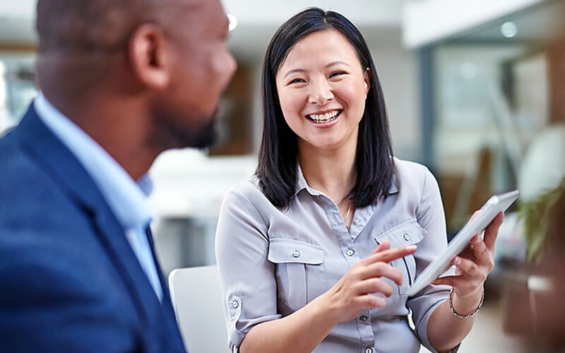 Businessman working outside on tablet device