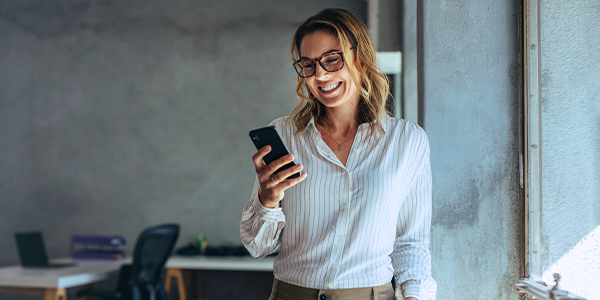 Mature businessman working on laptop computer in bright office